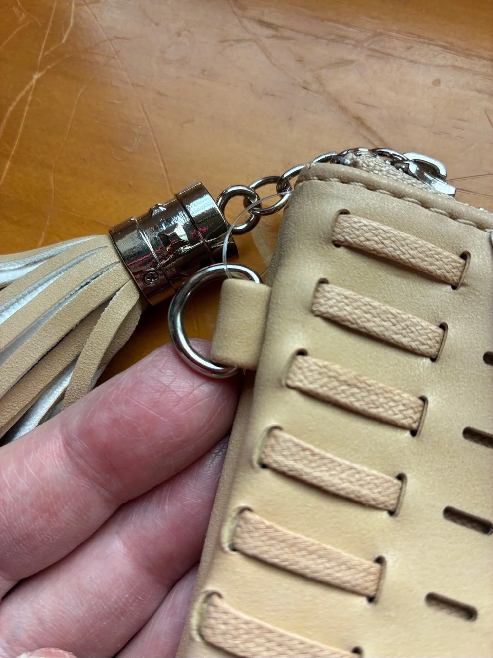 Woven Tassel Zip Clutch or strap is on the inside. Turns into a crossbody bag.